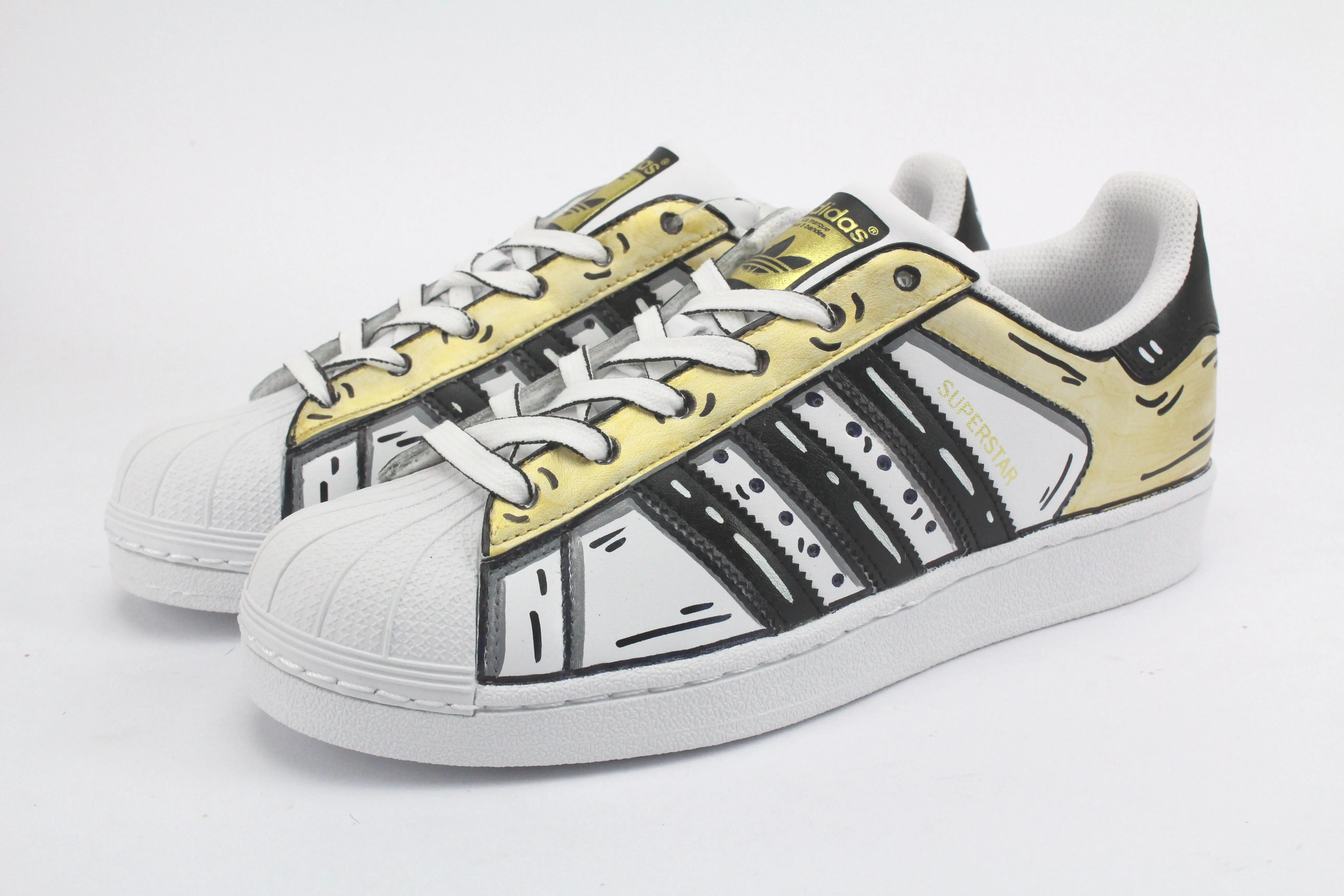 Adidas Superstar Cartoon Gold e lacci cartoon